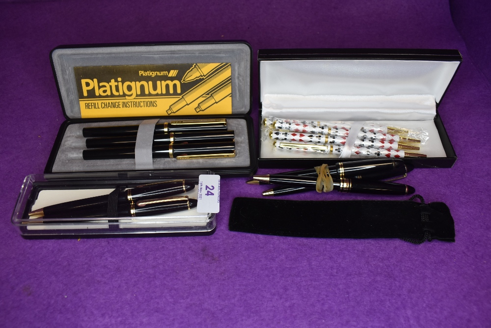 A collection of ball point pens including Platignum.