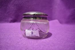 A cut glass dressing table pot having HM silver lid bearing monogram