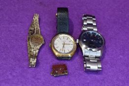 Two gents wrist watches, a ladies wrist watch and a royal souvenir charm