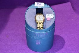 A gents Citizen Eco drive wrist watch with gold plated wrist strap