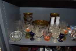 A selection of glass ware including two blue eye baths, and etched drinking glasses.