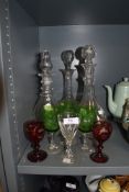 A lot containing three vintage decanters and an assortment of glasses including red and green