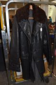 A vintage leather jacket with sheepskin collar,having double breasted fastening and lined in wool.