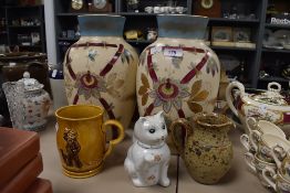 A pair of large ceramic hand painted mantle vase a Wade Heath mug earthen ware jug and cat teapot