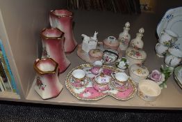 A selection of dressing table items including graduated jug set and storage jars