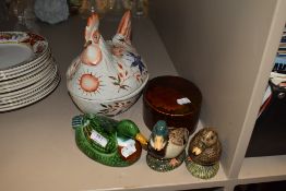 A selection of ceramic birds including Hen egg nest, two mallards and a lidded dish