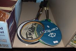 A selection of badminton and similar tennis or squash style rackets