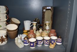 A selection of vintage items including blush dressing table set, egg cups and planter.