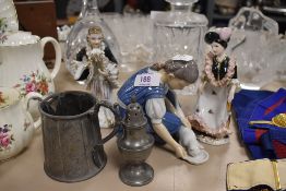 A porcelain Danish figure base similar to Copenhagen and a pewter salt and creamer