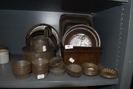 An interesting collection of vintage cake tins,loaf tins, cutters and more.