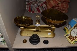 A set of vintage brass dished kitchen scales and graduated weight set