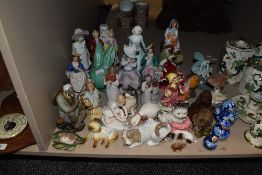 A selection of figures and ceramic studies including porcelain mudman and Royal Doulton some AF