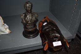 A cast metal bust on wooden mount 'Nelson British and Foreign sailor society' also a tribal mask.