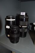 Three camera lenses; a Paragon 135mm, A Chinon zoom 85-210mm, A Soligor 200mm.