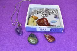 A selection of polished stone necklaces etc