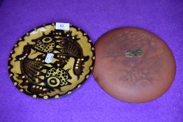 A pair of Hampton pottery earthenware plates having fish in brown and green hues depicted to Ochre