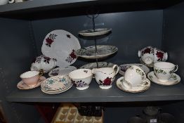 A mixed lot of general ceramics including cups and saucers and cake stand with three tiers.