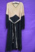 A 1930s black and taupe lace dress, having silk lining and belted waist.