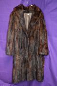 A vintage Mahogany coloured mink coat, medium to larger size.