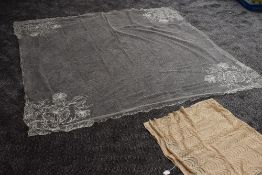 An intricate wedding veil having braided detail, around 1930s also included is a shawl or similar.