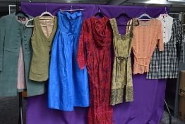 A mixed lot of ladies vintage clothing including maxi dress, waist coat and more.