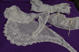 A Victorian fine shawl or collar having extensive embroidery and lace flowers, also included is a