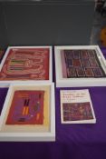 Three vintage framed embroidered Mola samples, also included is a book, Textiles of the Kuna