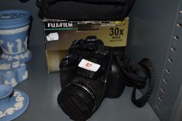 A Fujifilm Finepix HS10 camera.