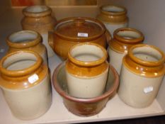 A selection of earthen ware salt glazed jars and similar crock pot