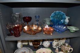 A collection of mixed glass including carnival glass and etched examples.