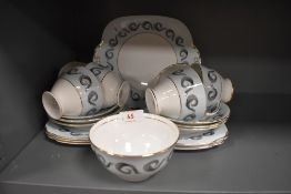A selection of vintage Windsor bone china including cake plate, cups, saucers and side plates having