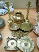 A selection of brass and similar wares including Automobile Rally dishes and heavy set candle