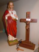 Two religious figures of Jesus on crucifix and similar plaster cast and painted version