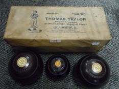 A set of antique crown green bowls by Thomas Taylor turned lignum 2 1/2 bias