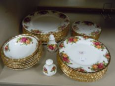 A selection of dinner and side plates also bowls by Royal Albert Old Country Roses