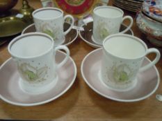 Four Susie Cooper coffee canisters with saucers and a mantle urn af