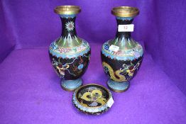 Two cloisonné vases and a trinket bowl having dragon decoration.