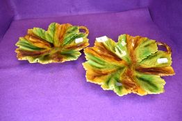 A pair of majolica style leaf dishes.