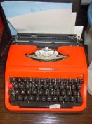 A genuine vintage Underwood typewriter in a bright 70's orange body as new