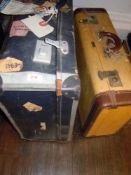 Two vintage suitcases one having some interesting stickers for BOAC, Cunnard, British railways and