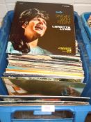 A box full of vinyl records predominantly country and easy listening interest.