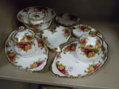 A selection of side plates and lidded jars by Royal Albert in the Old Country Roses design