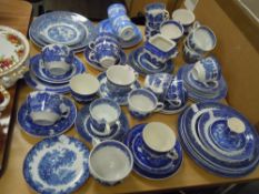 A selection of vintage blue and white wear ceramics including tea cups and saucers Willow wear etc