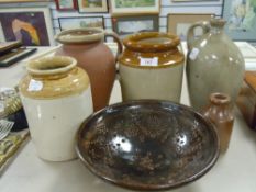 A selection of earthen ware salt glazed jugs and jars