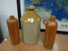 A selection of earthen ware salt glazed bottles and flagon advertising Oswestry