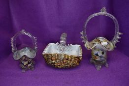 Three colourful vintage glass baskets.