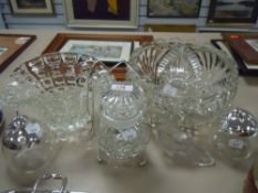 A selection of clear cut and pressed glass including cruet sets and fruit styled condiment jars