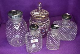 A collection of vintage jars,bottles/decanters having enamel detailing throughout.