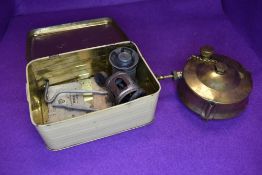 A vintage brass Veritas stove in a original tin box.