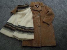 A vintage sheepskin coat and a mohair or similar poncho.